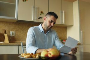 Texas homeowner reviewing property tax appraisal notice at home